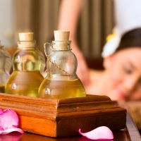 When should oil massage be done on the body, before bath or after bath?